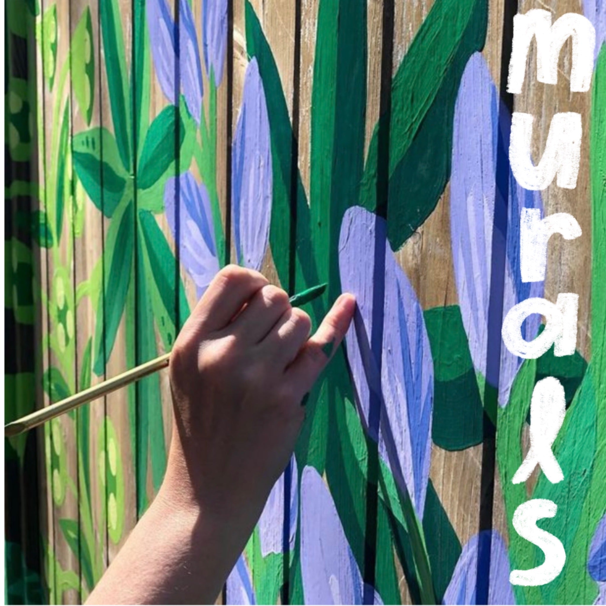 Painting a mural of a lupine flower close up