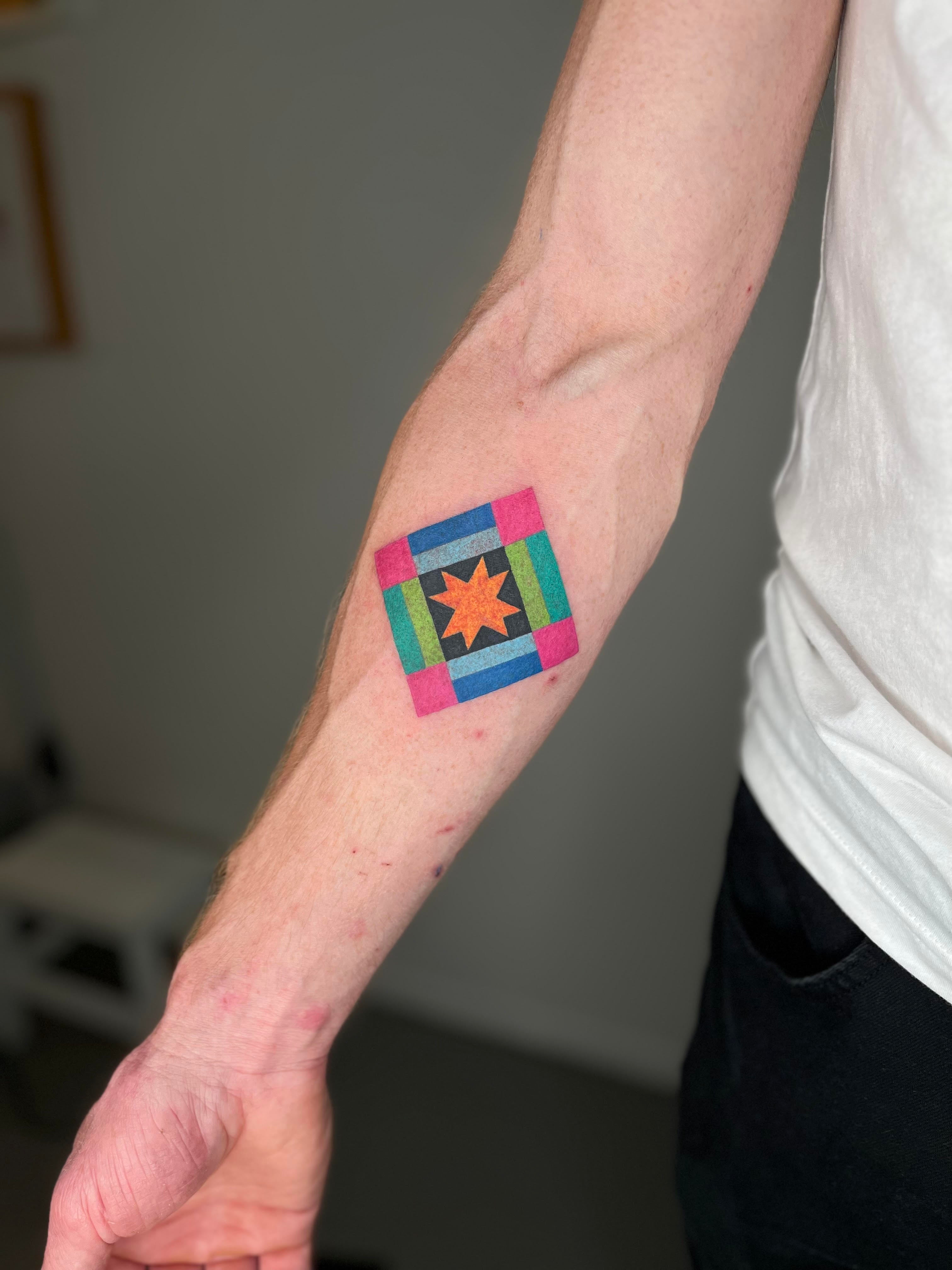 Single quilt square tattoo