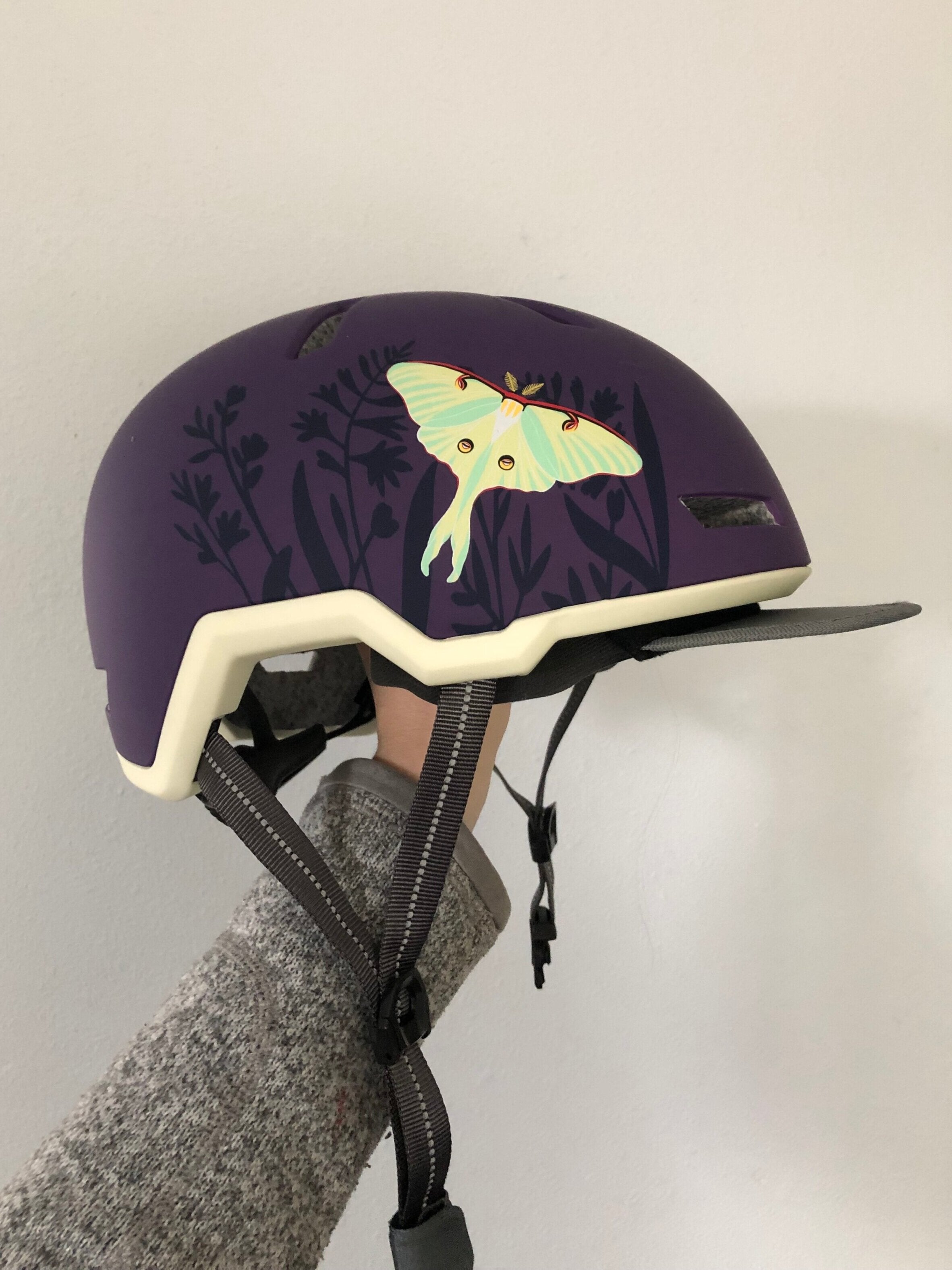 Bike helmet with moon moth painted by Lauren Blair