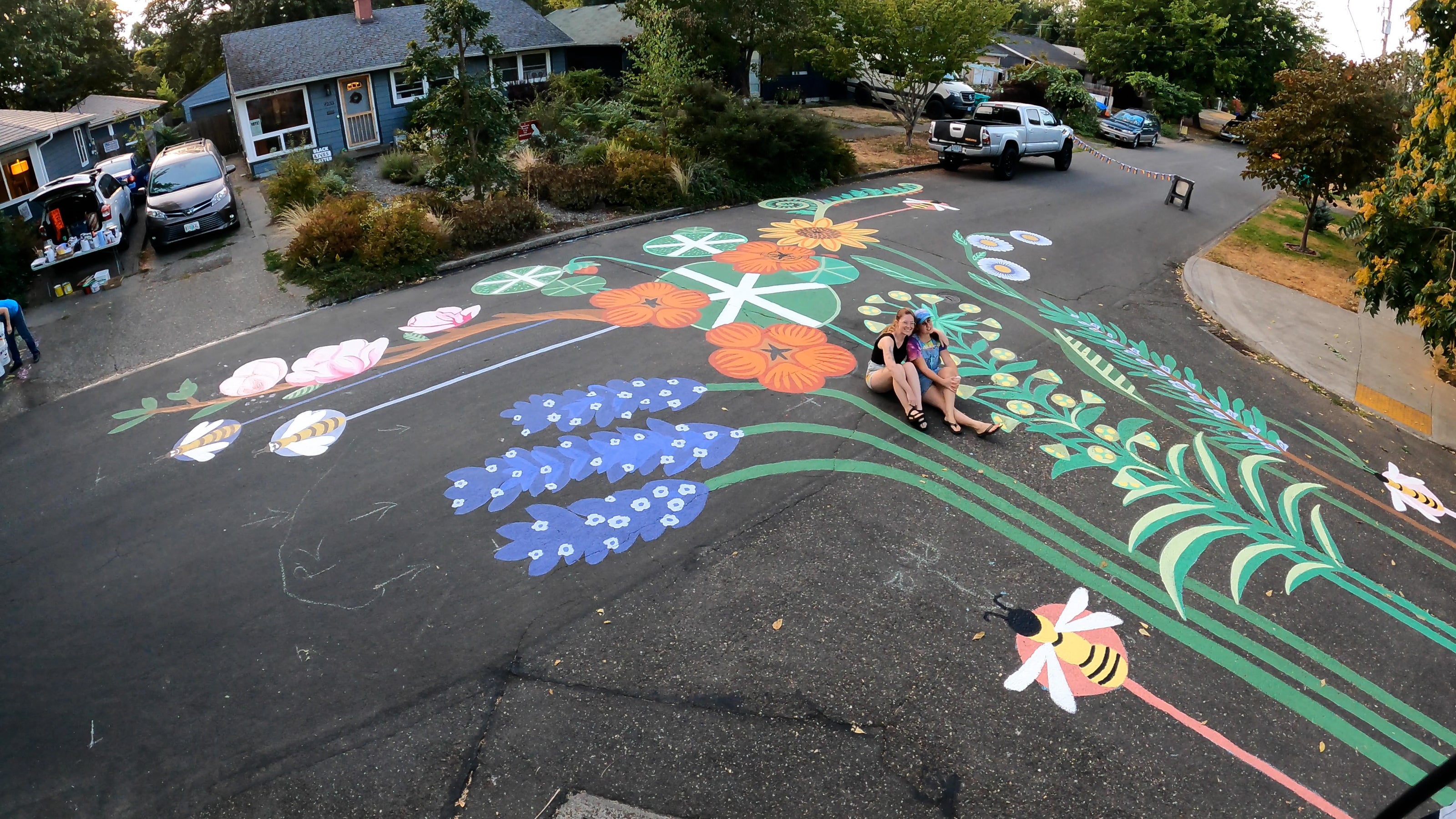 Street mural in progress by Lauren