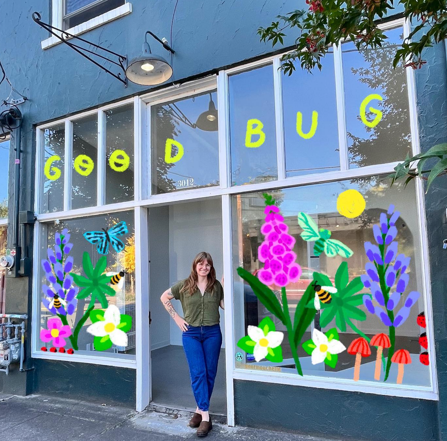 Lauren Blair standing in front of storefront and tattoo shop, Good Bug