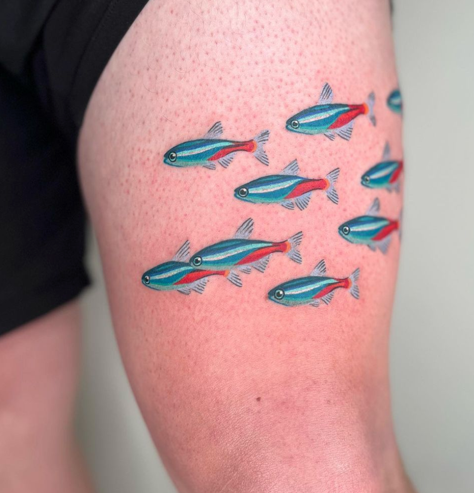 Neon Tetreas school of fish tattooed by Lauren Blair